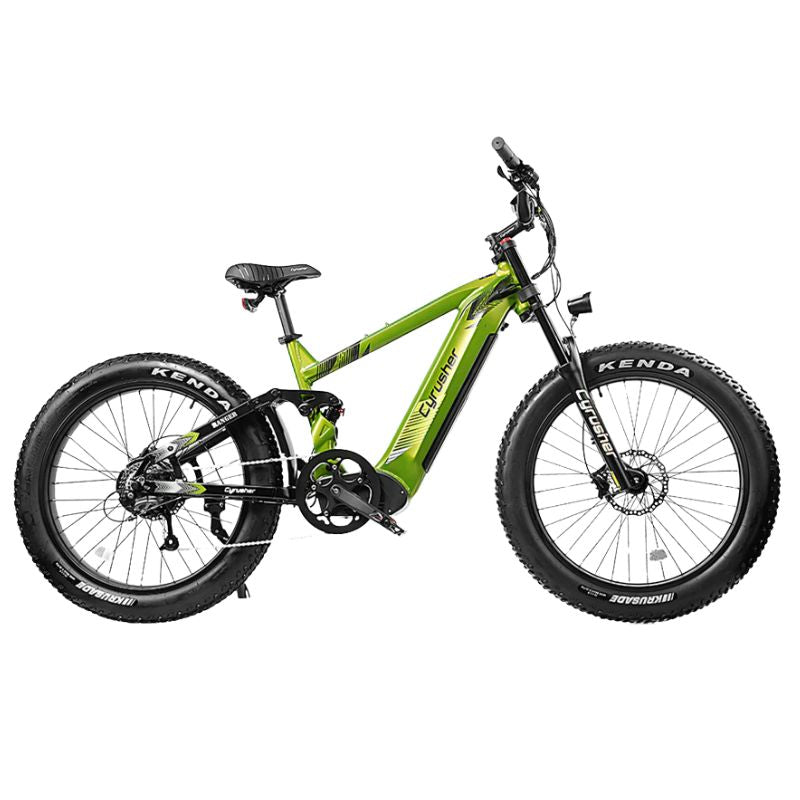 Detail of Kenda 26″ × 4″ fat tyre in muddy terrain