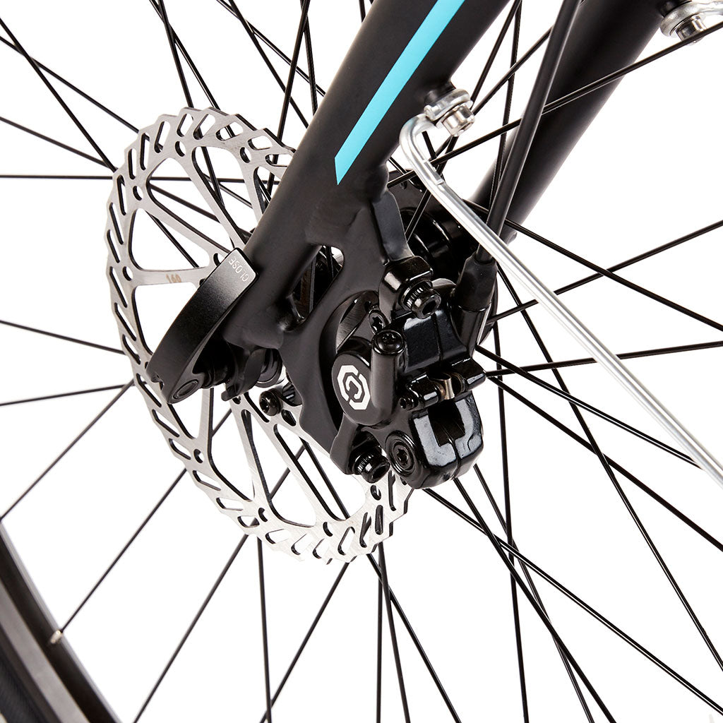 Front view of Commute INT e-bike with LED lighting and wide tyres